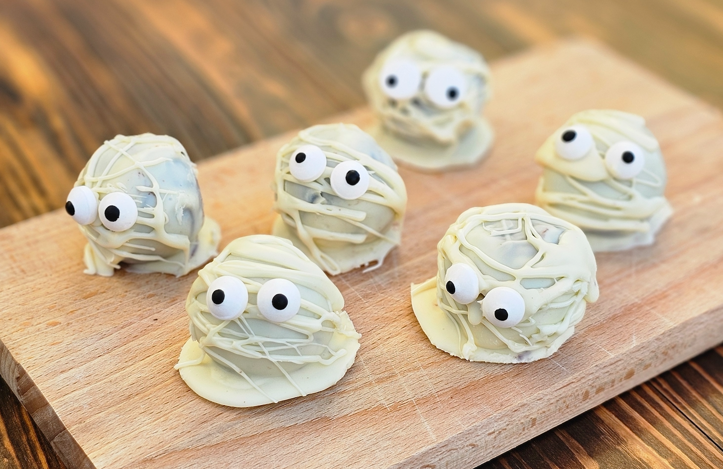 White chocolate coated chocolate brownies in the shape of mummies