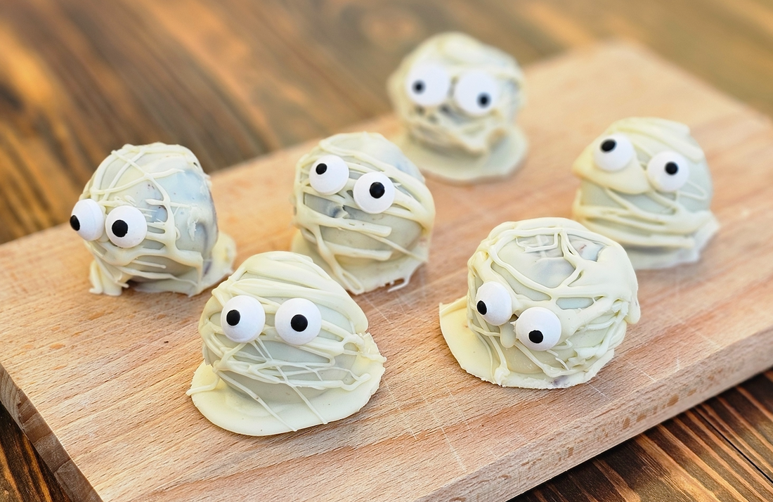 White chocolate coated chocolate brownies in the shape of mummies